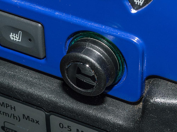 Britpart Chrome Top 12V Power Socket Blanking Plug, close-up of the black blanking plug inserted into a vehicle's power socket. Britpart Chrome Top 12V Power Socket Blanking Plug, close-up of the black blanking plug inserted into a vehicle's power socket.