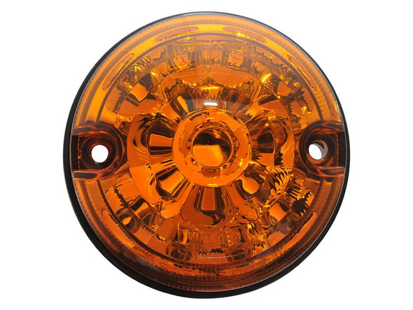 WIPAC LED Front Indicator for Defender, orange circular automotive light with clear lens and two mounting holes.