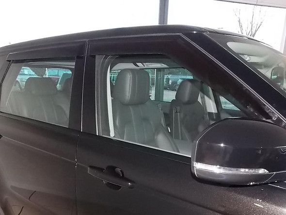 Britpart Window Wind Deflector Set for Range Rover Sport L494, vehicle side view showing the wind deflectors installed on the window roll. Britpart Window Wind Deflector Set for Range Rover Sport L494, vehicle side view showing the wind deflectors installed on the window roll.