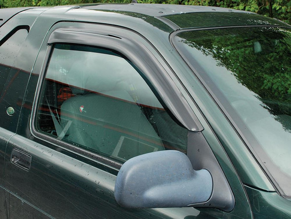 Britpart Wind Deflector Kit for Freelander 1 Two Door, installed on the vehicle's window to reduce wind noise and turbulence during driving.