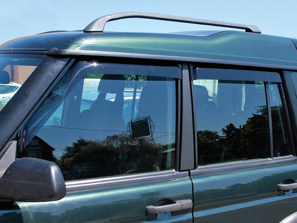 Britpart Window Wind Deflector Set for Discovery 2, vehicle side window with wind deflectors installed.