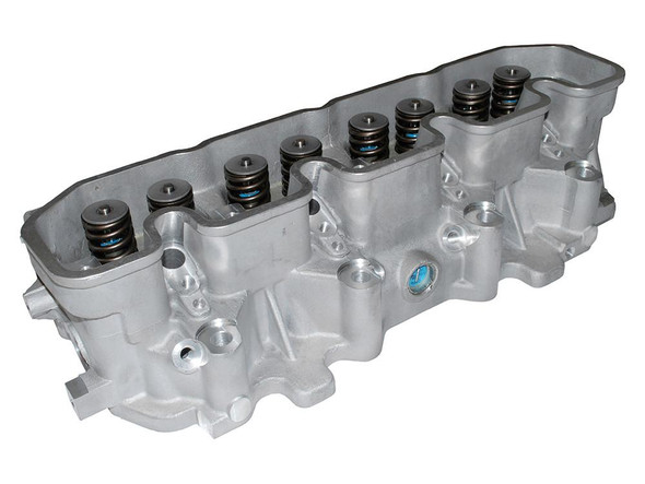 Britpart Discovery 1 300TDi Complete Cylinder Head, engine cylinder head made of metal with multiple head bolts and valve springs for Land Rover Discovery 1 with 300TDi engine.