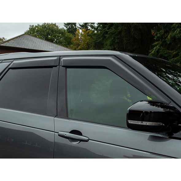 Britpart Window Wind Deflector Set for Discovery 5, close-up view of the deflectors installed on the vehicle's front windows.