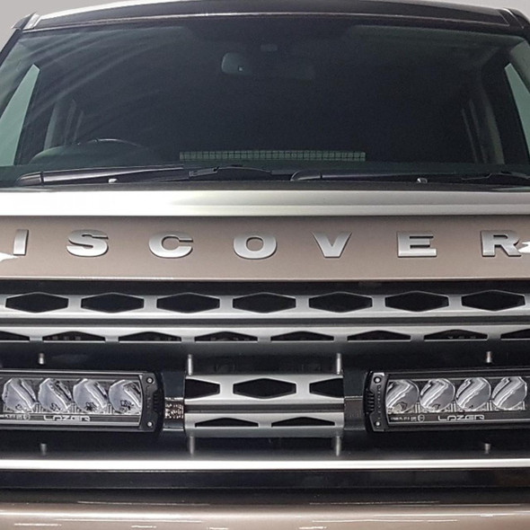 LAZER Grille Integration Kit Lazer for Discovery 4, front view of the grille featuring integrated Lazer LED lights installed on the vehicle's front bumper.