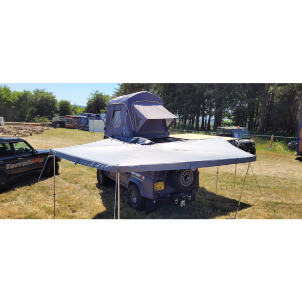 270 degree 4 wing awning open around vehicle showing extended coverage area
