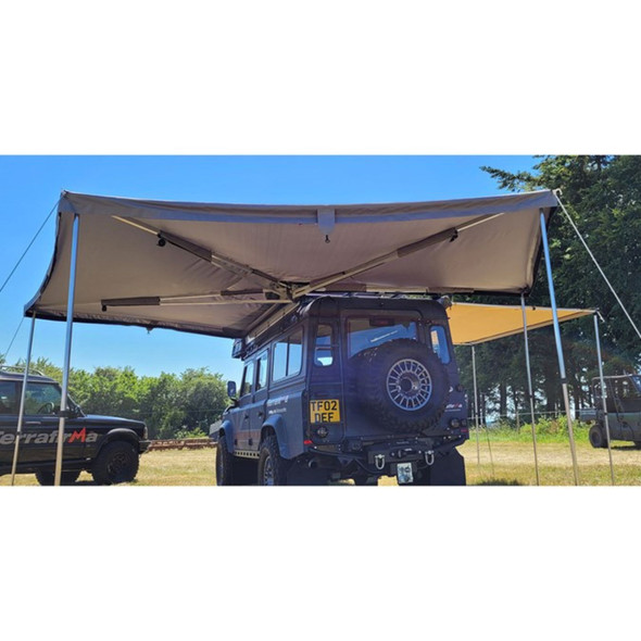 Vehicle mounted 270 degree awning creating shaded camping and working area
