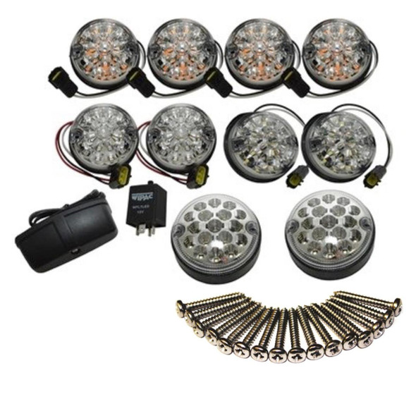 WIPAC / BRITPART Clear LED Deluxe Lens Lamp Upgrade Kit with 73mm Lens for Defender, featuring multiple LED lamps with wiring, mounting hardware, and adapters for vehicle lighting enhancement.