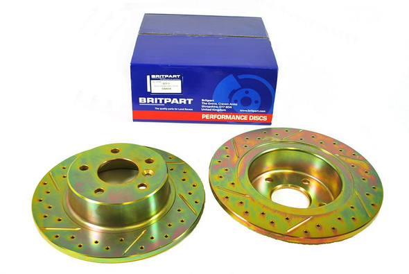 Britpart Rear Solid Brake Discs Drilled and Grooved Performance Upgrade for Discovery 2, new brake discs with drilled holes and grooved surface for enhanced braking performance.