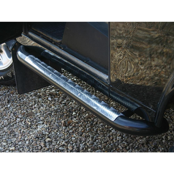 Britpart Side Steps Tubular Tomb Raider Style for Defender 90, black tubular side steps with silver patterned finish installed on a black vehicle.