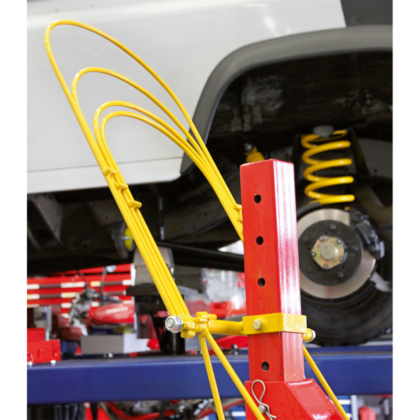 Restraint System for Coil Spring Compressors