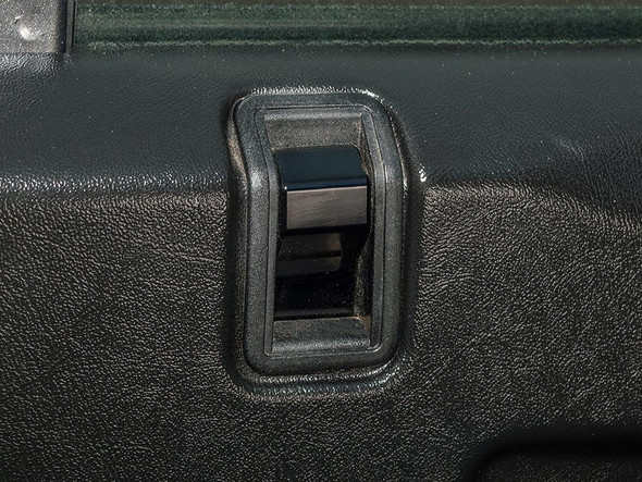 Britpart Black Aluminium Door Lock Peg for Defender, close-up of the black aluminium door lock peg installed on a vehicle door.