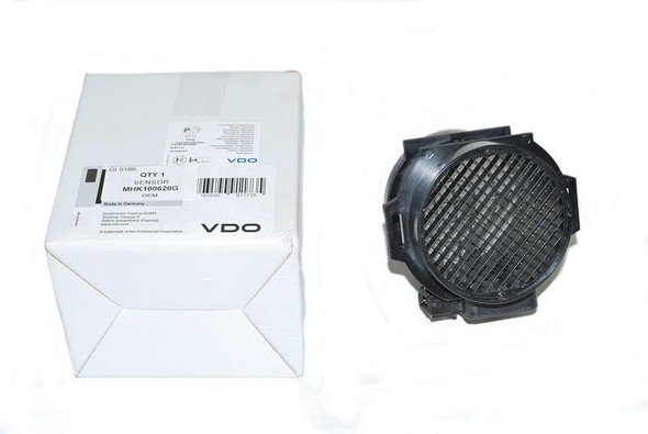 VDO Siemens VDO/Continental Mass Air Flow Sensor for Defender & Discovery 2 Td5, black circular sensor with grid and packaging box.