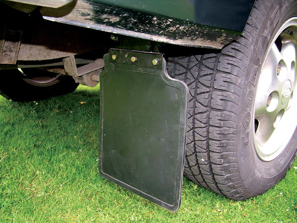 Product: Replacement Rear Mudflap Set for Discovery 1 (1989-1998), image showing a black mudflap attached to the rear wheel of a vehicle with a green body.