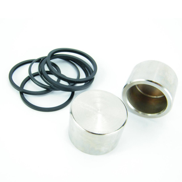 Direct Replacement Rear Brake Caliper Repair Kit STC1279 for Defender 90 & Discovery, including black rubber O-rings and metal cylinders for brake system repair.