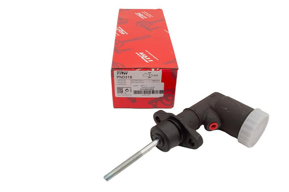TRW Clutch Master Cylinder TRW LUCAS for Defender, automotive clutch hydraulic component with black body, white cap, and metal rod, placed next to red TRW box.