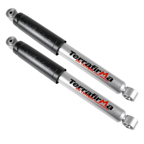 Terrafirma Pair of Terrafirma All-Terrain Rear Shock Absorbers for Discovery 2, durable silver shock absorbers with black protective covers and branding, designed for off-road vehicle suspension.