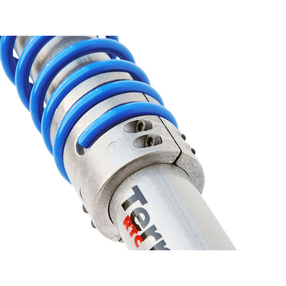 Terrafirma Return to Centre Steering Damper for Defender, close-up of the silver shock absorber with blue coil spring - TF835 from JGS4x4.
