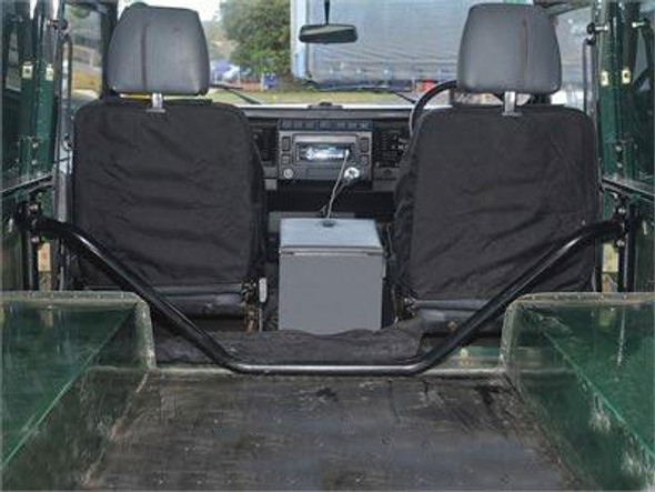 OEM Parts Tubular Rear Bulkhead Removal Kit - DA1810 for Defender, interior view showing the rear bulkhead removed with the seats visible.