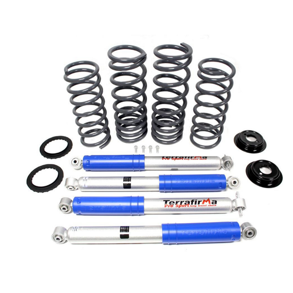 Terrafirma 2" Lift Heavy Load Air to Coil Conversion Kit for Discovery 2, image showing four shock absorbers, eight coil springs, and associated mounting components.