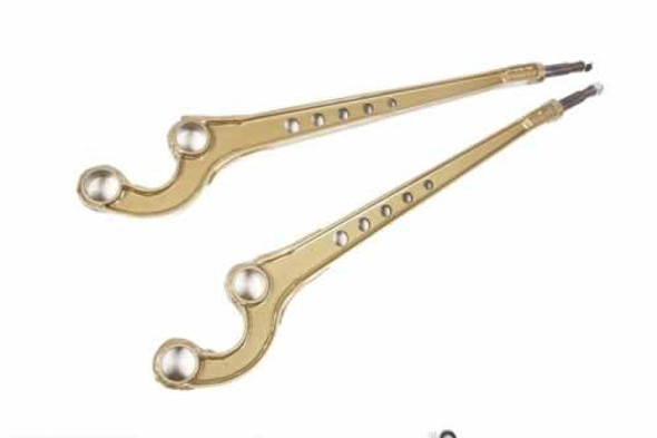 Terrafirma 3 Degree Caster Corrected Front Radius Arms for Defender, Discovery 1, Range Rover Classic, pair of gold-colored suspension components with ball joints and multiple mounting holes for vehicle upgrades.