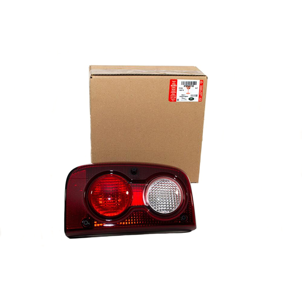 Genuine Land Rover Rear Left Hand Side Upper Tail Light for Freelander 1, image shows the tail light assembly with red and white sections placed beside its packaging box.