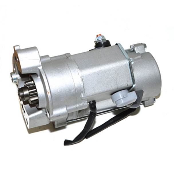 Product: Direct Replacement Freelander 2 TD4 Starter Motor Manual, image showing a silver metallic starter motor with electrical connectors and gear mechanism for car engine.