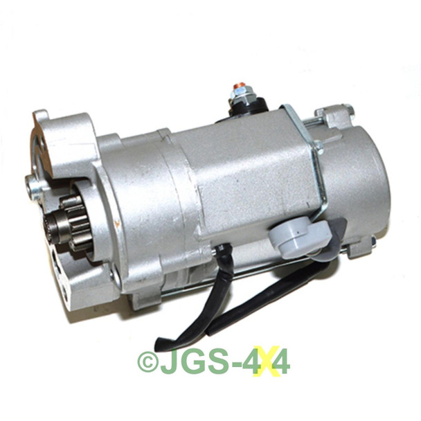 Product: Direct Replacement Freelander 2 TD4 Starter Motor Manual, image showing a silver metallic starter motor with electrical connectors and gear mechanism for car engine.