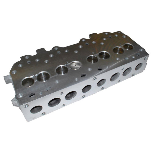 Direct Replacement Cylinder Head Complete for 300Tdi Engines, image of an engine cylinder head with multiple drilled holes for valves and mounting points.