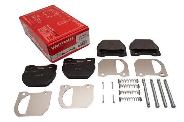 Product BRITPARTXS Rear Brake Pads Britpart XS for Defender 110/130 1994-2001, image showing brake pads with packaging box in the background.