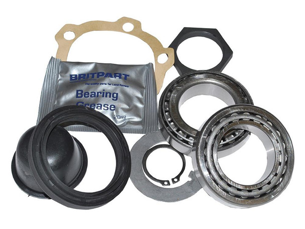 Britpart Front Wheel Bearing Kit for Defender (1986-1993), detailed image showing wheel bearing, gasket, grease packet, and mounting hardware. Britpart Front Wheel Bearing Kit for Defender (1986-1993), detailed image showing wheel bearing, gasket, grease packet, and mounting hardware.
