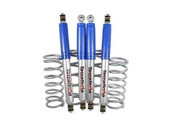 Terrafirma Defender 110/130 Pro-Sport Medium Load Suspension Kit, image showing four blue shock absorbers with coil springs for off-road vehicle suspension enhancement. Terrafirma Defender 110/130 Pro-Sport Medium Load Suspension Kit, image showing four blue shock absorbers with coil springs for off-road vehicle suspension enhancement.