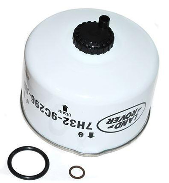 Genuine Land Rover Diesel Fuel Filter Genuine Land Rover Parts for Discovery 3 & 4, image showing a white cylindrical diesel fuel filter with black cap and two rubber O-rings.