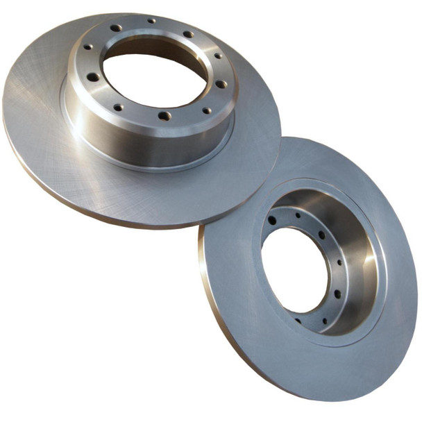 Direct Replacement Rear Brake Disc x2 for Defender & Discovery 1, image of two metallic vehicle brake discs with drilled holes for fitting. Direct Replacement Rear Brake Disc x2 for Defender & Discovery 1, image of two metallic vehicle brake discs with drilled holes for fitting.