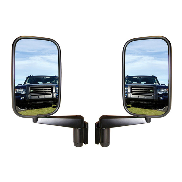 Direct Replacement Door Wing Mirrors with Arms (Pair) - MTC5217 for Defender 90/110/130, side view of two black wing mirrors showing reflective surfaces reflecting a Land Rover Defender vehicle on grassy terrain under a blue sky.
