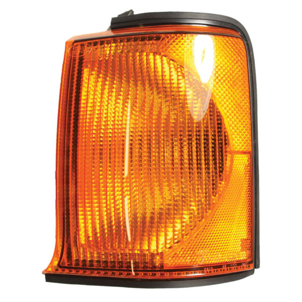 Product: Direct Replacement Front Left Indicator Light Lamp for Discovery 2, close-up of the orange front left indicator light lamp with black border for vehicle signalling. Product: Direct Replacement Front Left Indicator Light Lamp for Discovery 2, close-up of the orange front left indicator light lamp with black border for vehicle signalling.