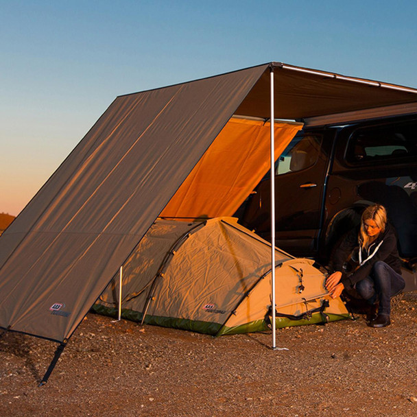 ARB 4X4 Accessories Expedition Awning Front Wind Break ARB - DA6840, outdoor setup with a vehicle, tent, and wind break at sunset.