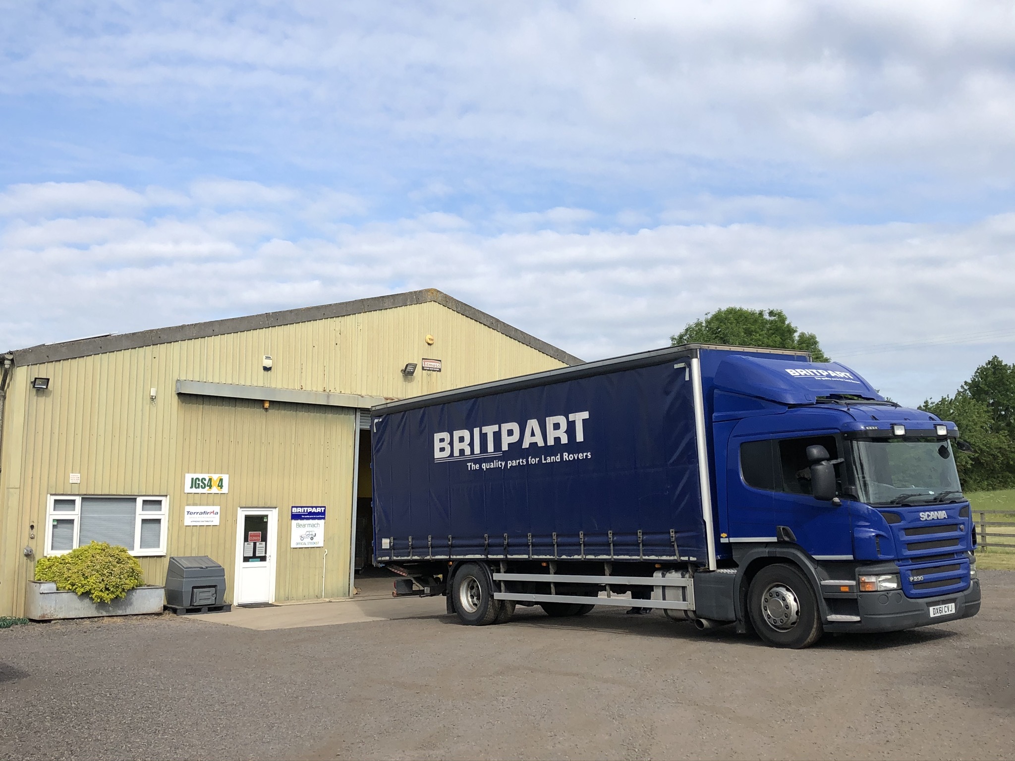 Britpart delivery lorry unloading Land Rover parts at the JGS4x4 warehouse in Isham