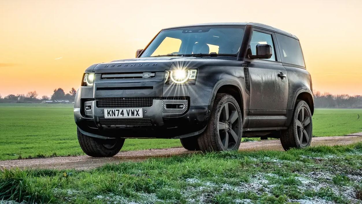 Land Rover Defender L663 driving along an off-road track