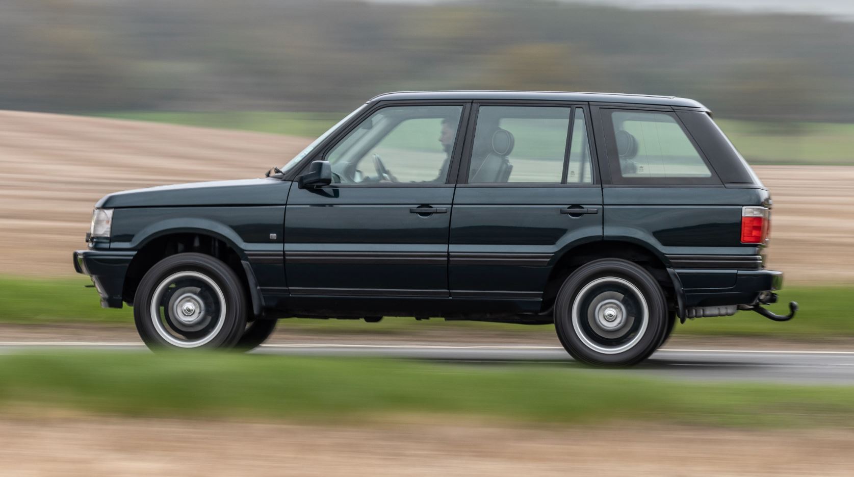 Range Rover P38 driving along a fast country road