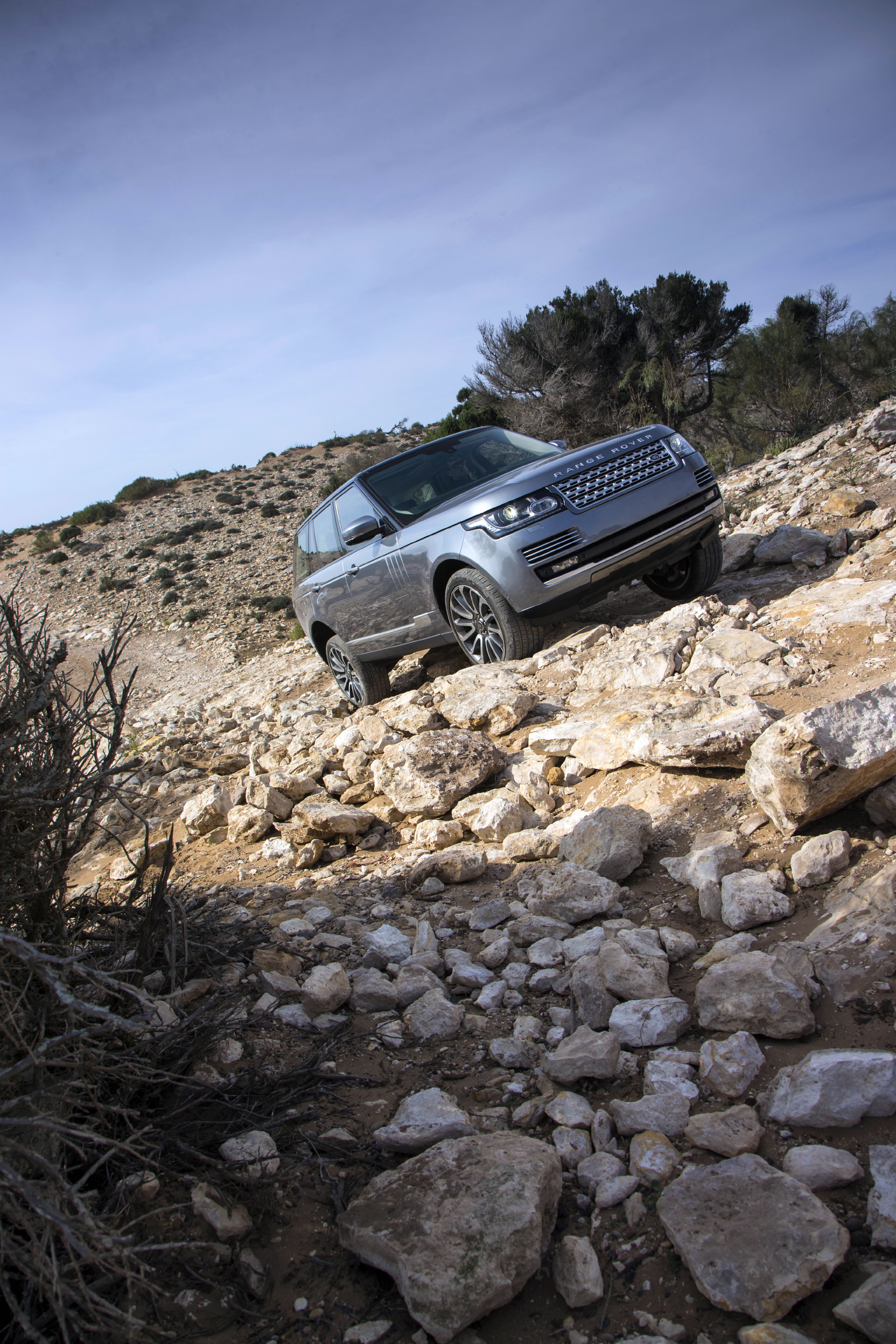 Range Rover L405 driving through a rocky Moroccan landscape
