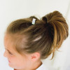 Cupcakes French Clip Barrette shown on a 1st grader with silky hair