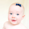 Our Mackenzie velvet baby bow shown on a bitty clip