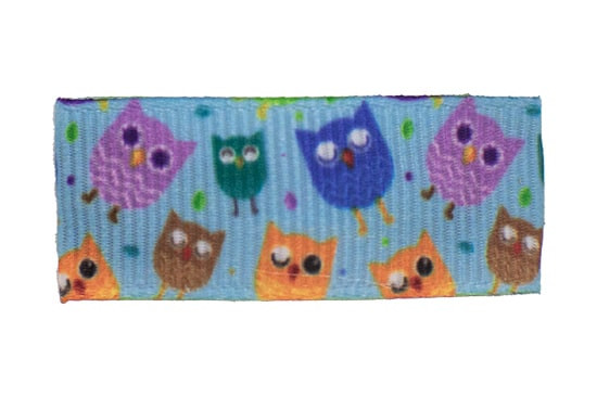 Toddler barrette with light orchid, royal, torrid orange, and assorted color owls on blue background