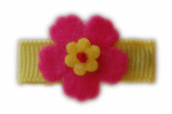 Hailey shocking pink flower shown on  a primary yellow bitty clip