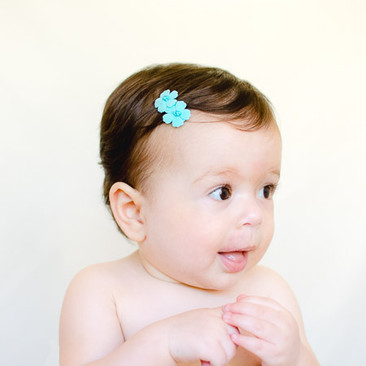 Turquoise velvet baby hair clips, shown on our no-slip baby clip specialty for fine hair