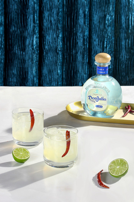classic margarita with a chile pepper garnish on a star-studded backdrop