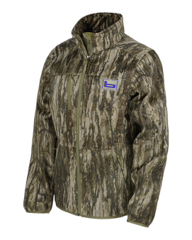 Angled view of the Banded Women's Soft Shell Camo Jacket in Realtree Legacy, showing the athletic fit and front-zip design with chest logo.