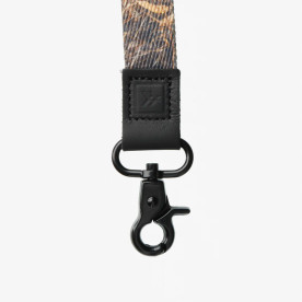 Close-up of Thread Realtree MAX-7 lanyard featuring black metal clasp and leather connector detail.