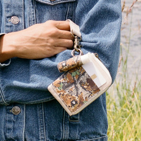 Thread Realtree Advantage Classic camo zipper wallet clipped to jeans with matching key accessory for everyday carry.