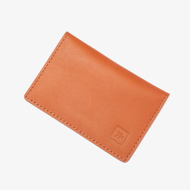 Closed Thread bifold wallet with smooth orange leather finish and stitched edges.